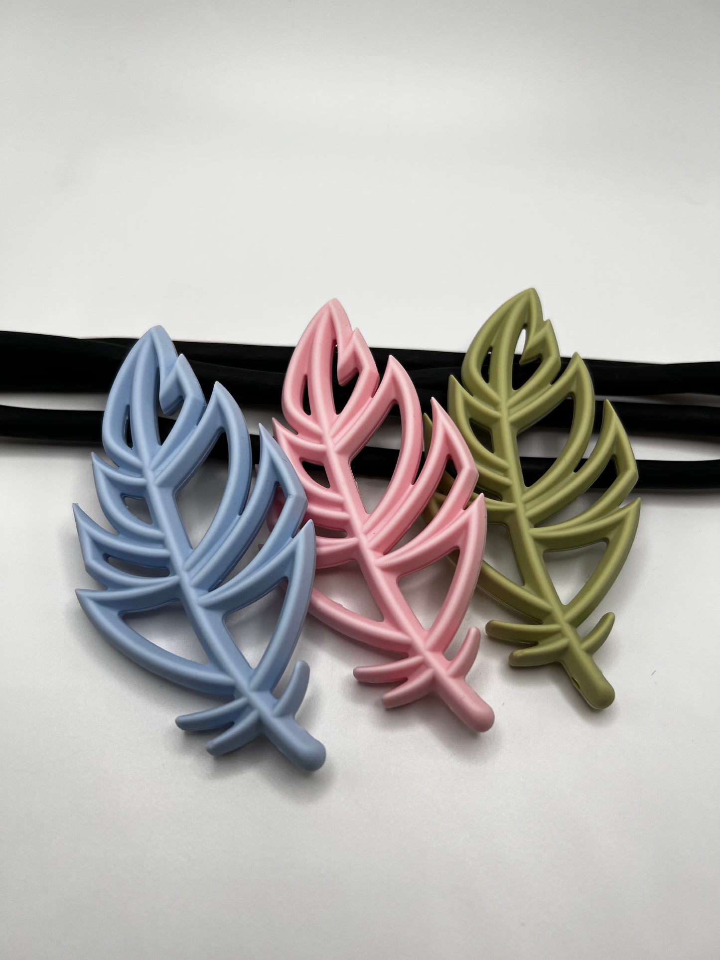 Jouet de dentition plume