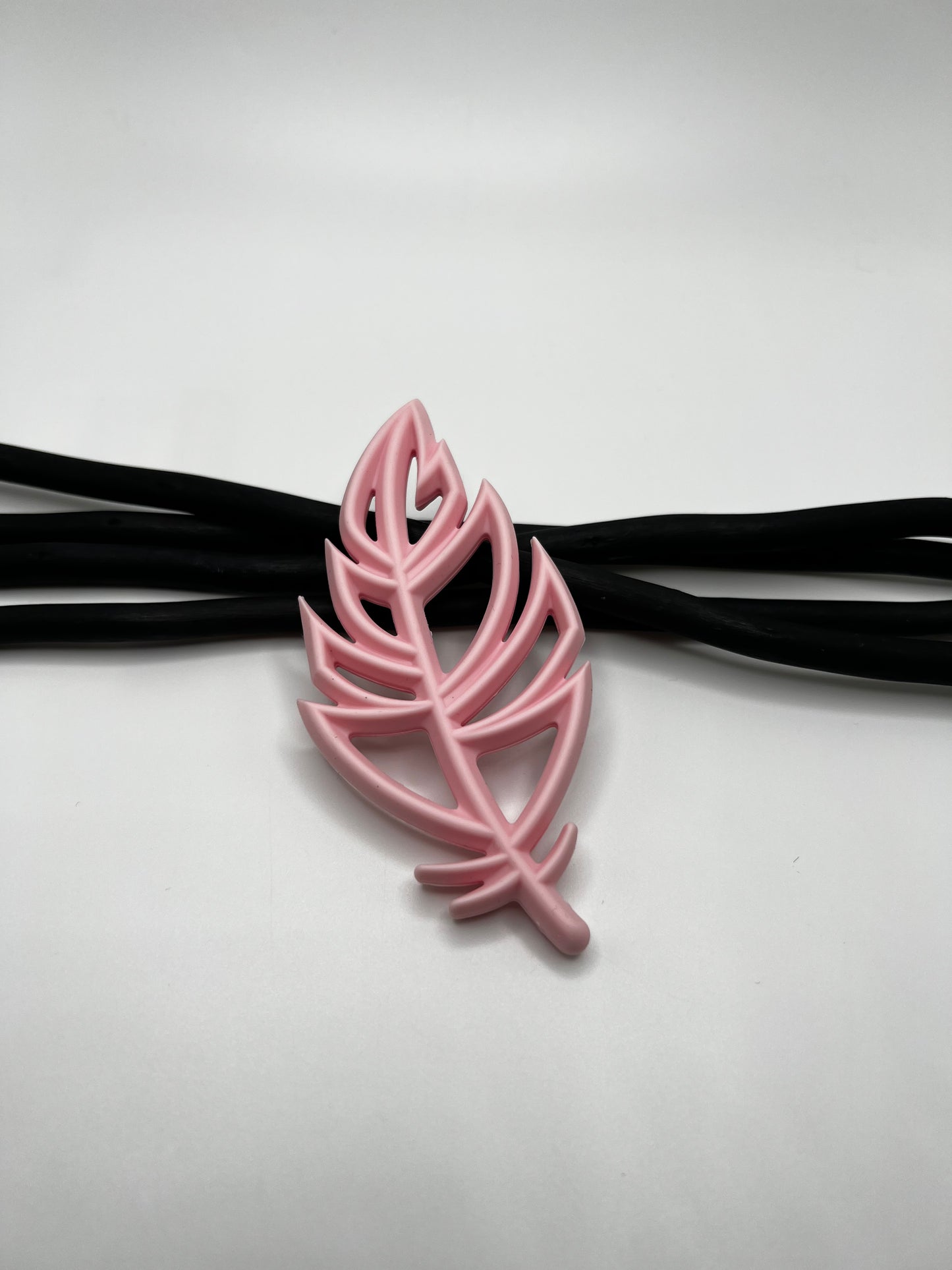 Jouet de dentition plume