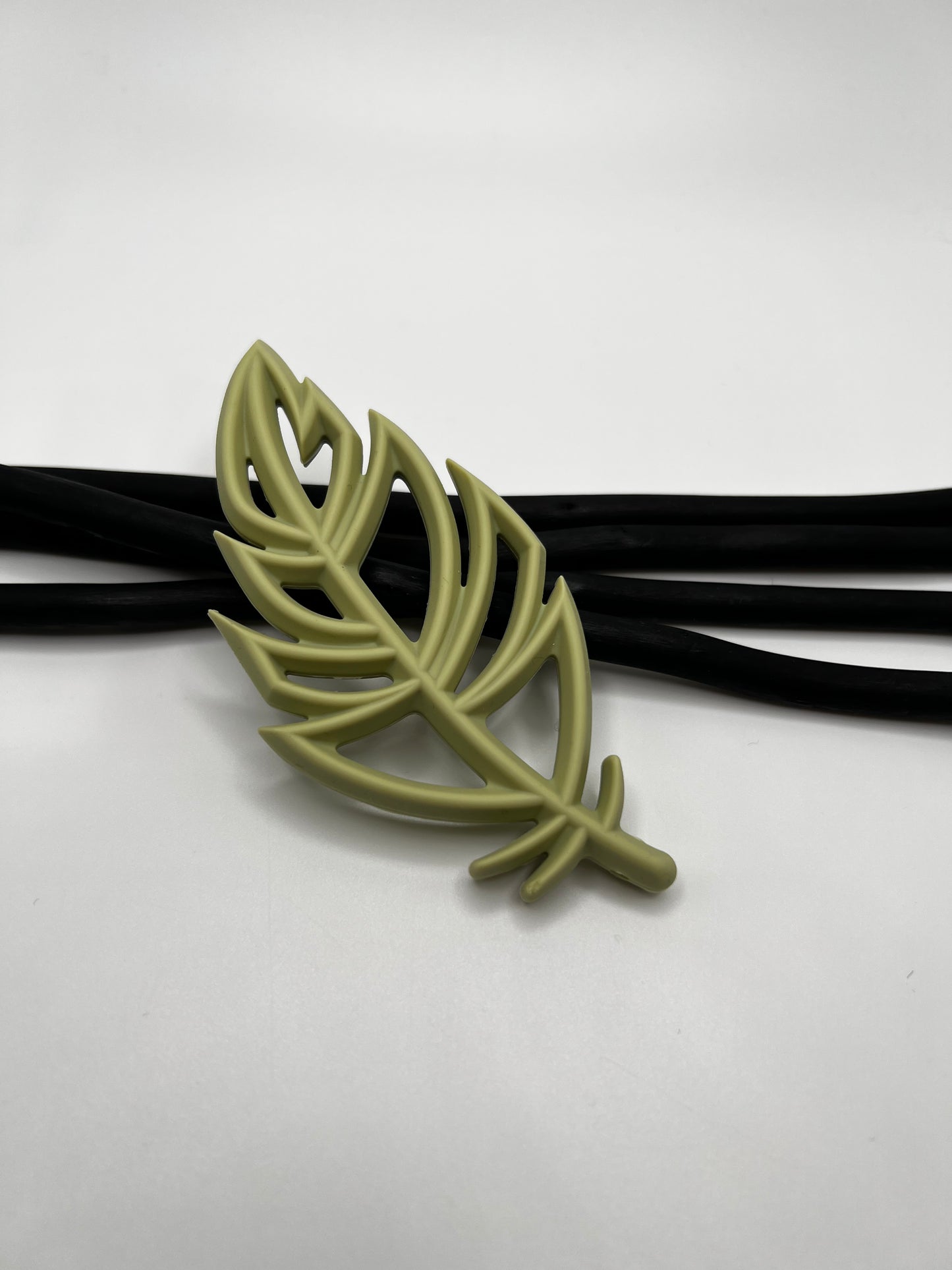 Jouet de dentition plume