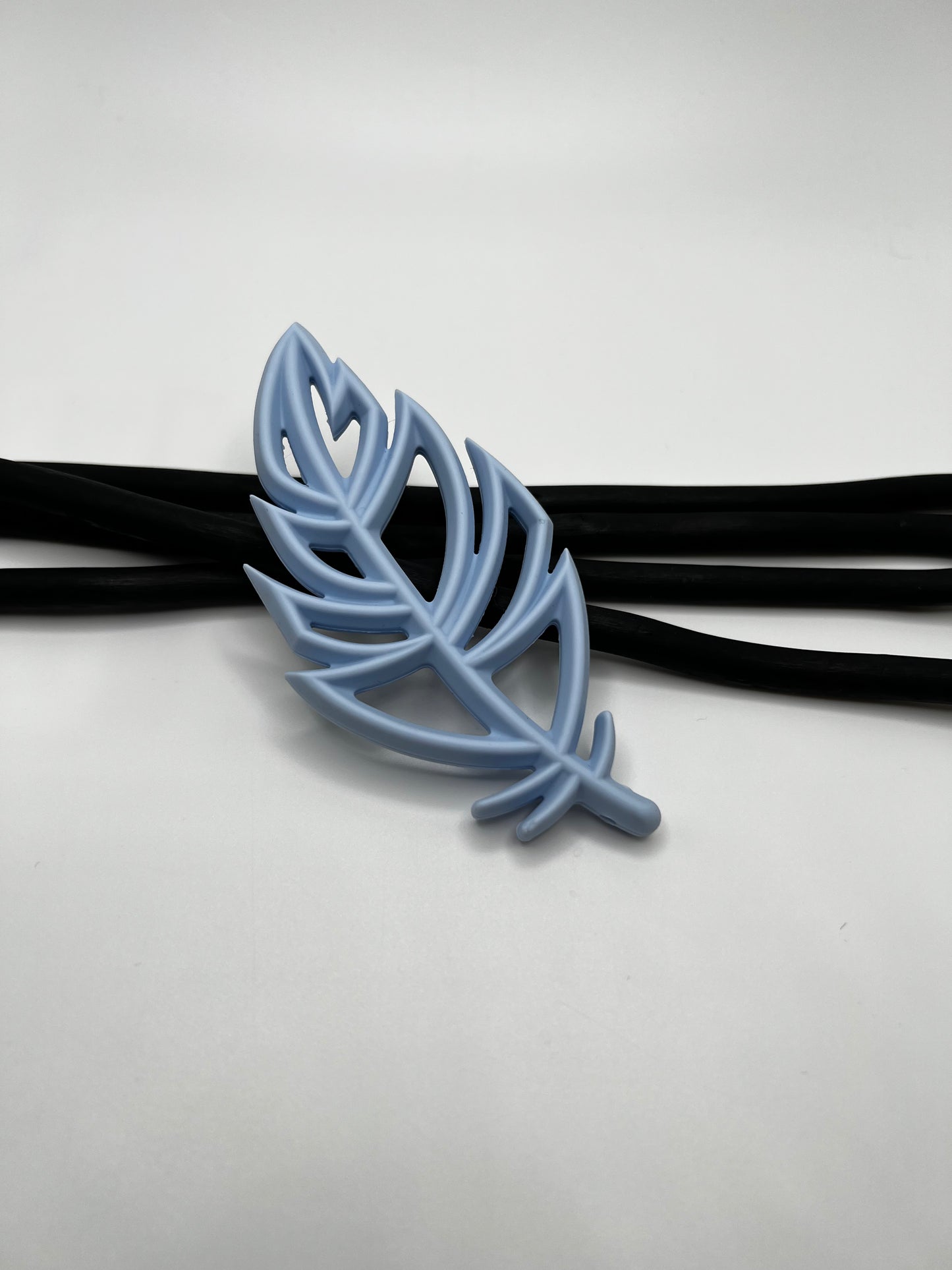 Jouet de dentition plume